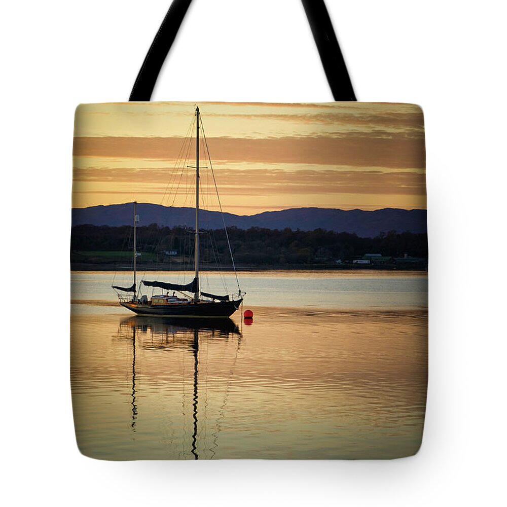 Blue Tote Bag featuring the photograph Boat On A Lake at Sunset by Rick Deacon