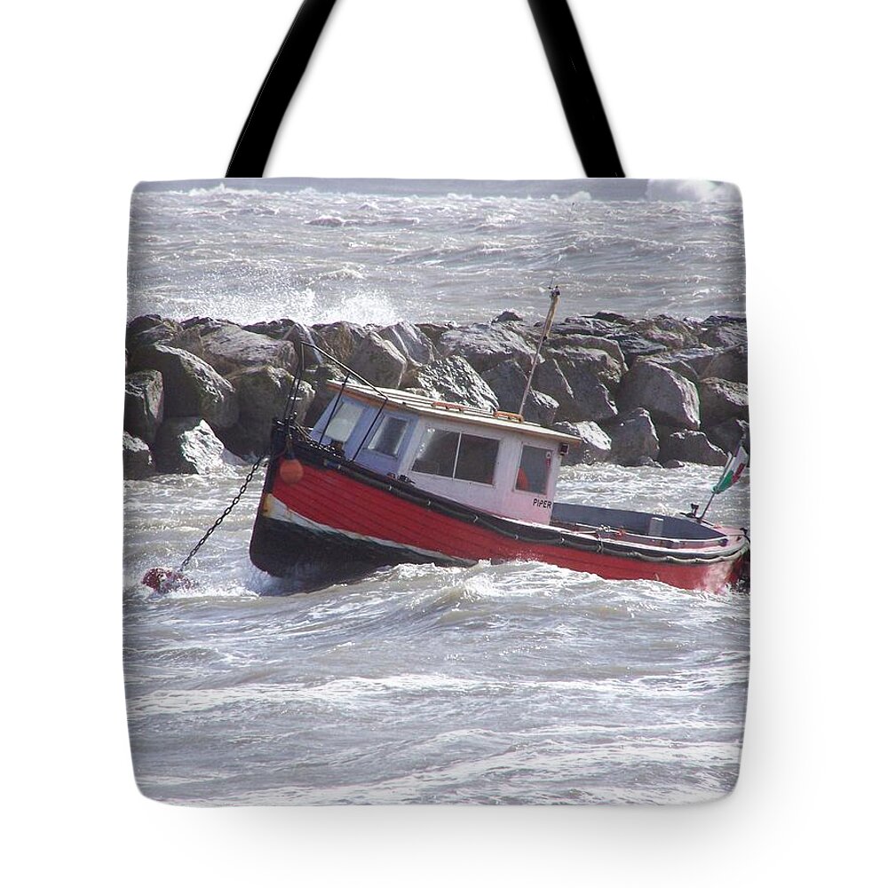 Boats Tote Bag featuring the photograph Bobbing boat by Christopher Rowlands