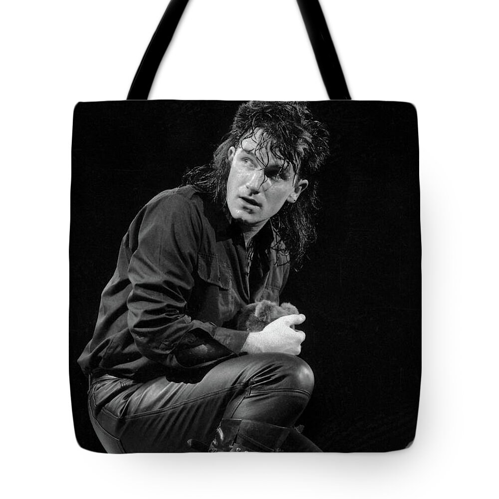 Bono Tote Bag featuring the photograph Bono 1984 by Russell Brown