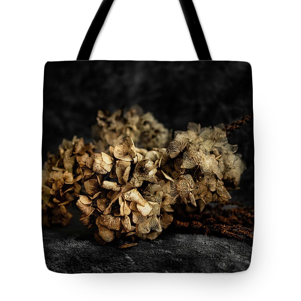 Bouguet Tote Bag featuring the photograph Bouquet of dried hydrangea flowers by MPhotographer