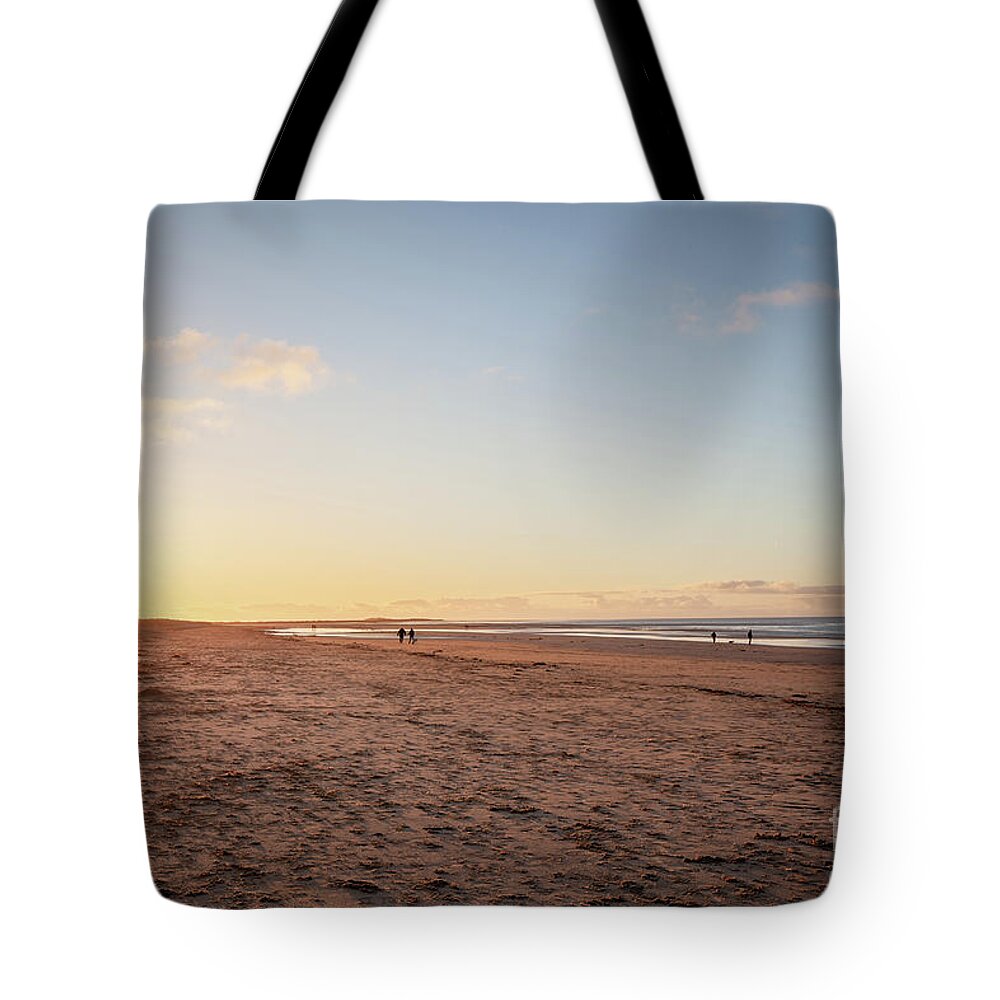Brancaster Tote Bag featuring the photograph Brancaster Beach North Norfolk at sunset by Simon Bratt