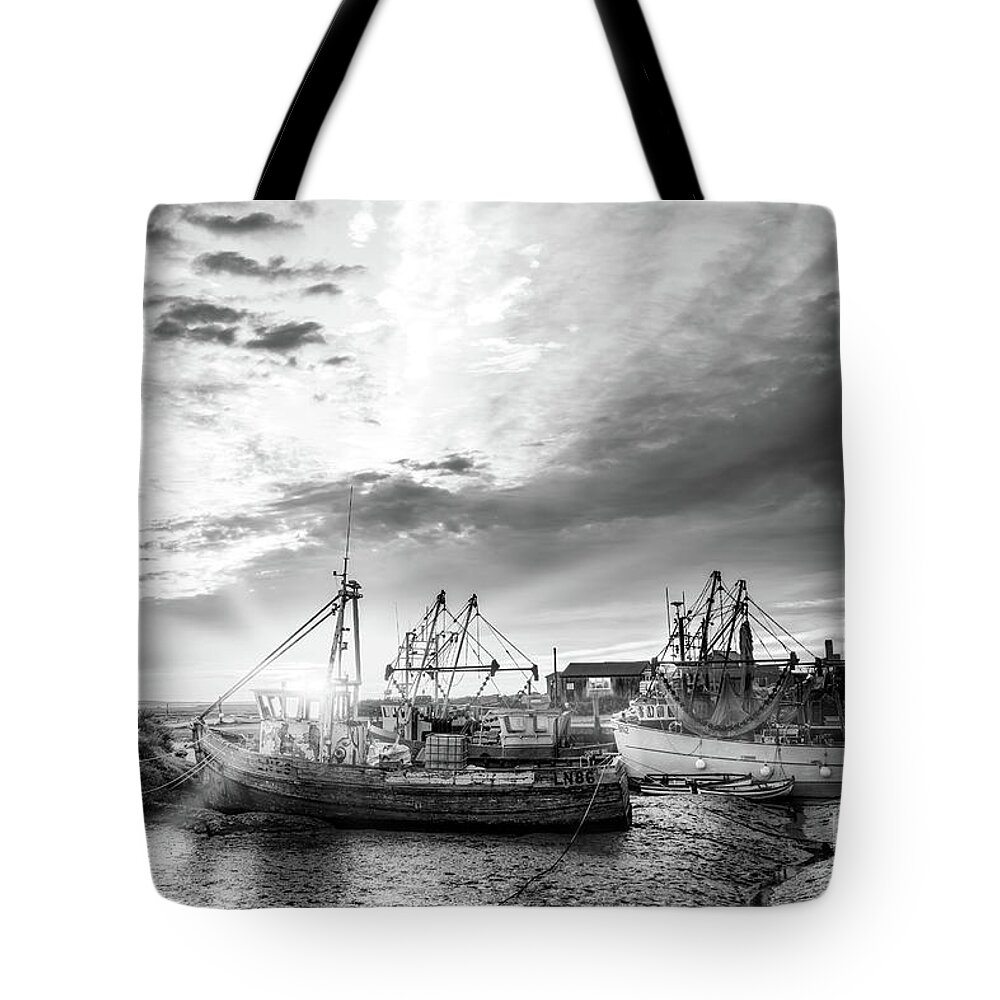Norfolk Tote Bag featuring the photograph Brancaster Norfolk fishing trawlers at sunrise BW by Simon Bratt