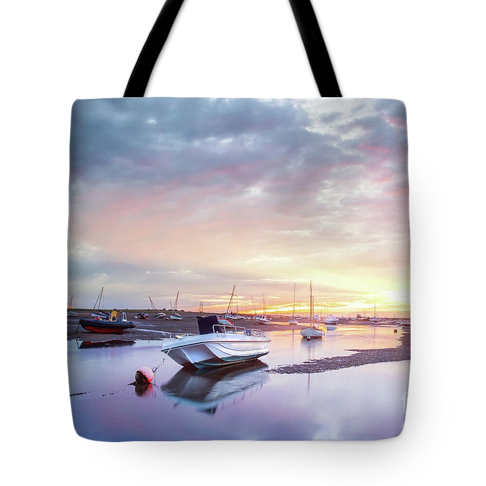 Norfolk Tote Bag featuring the photograph Brancaster Staithe boat harbour at sunrise in Norfolk by Simon Bratt