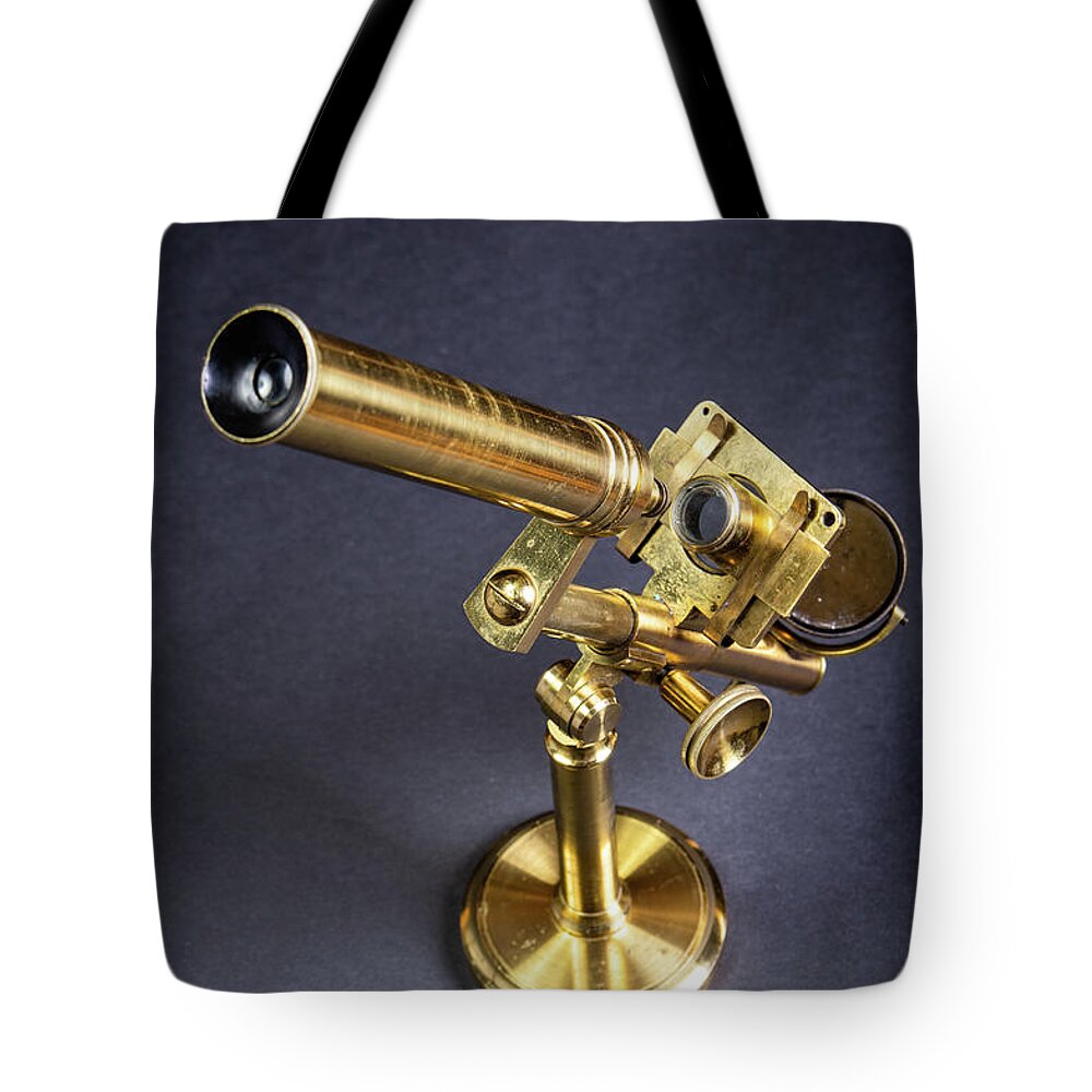 Microscope Tote Bag featuring the photograph Brass microscope by Average Images
