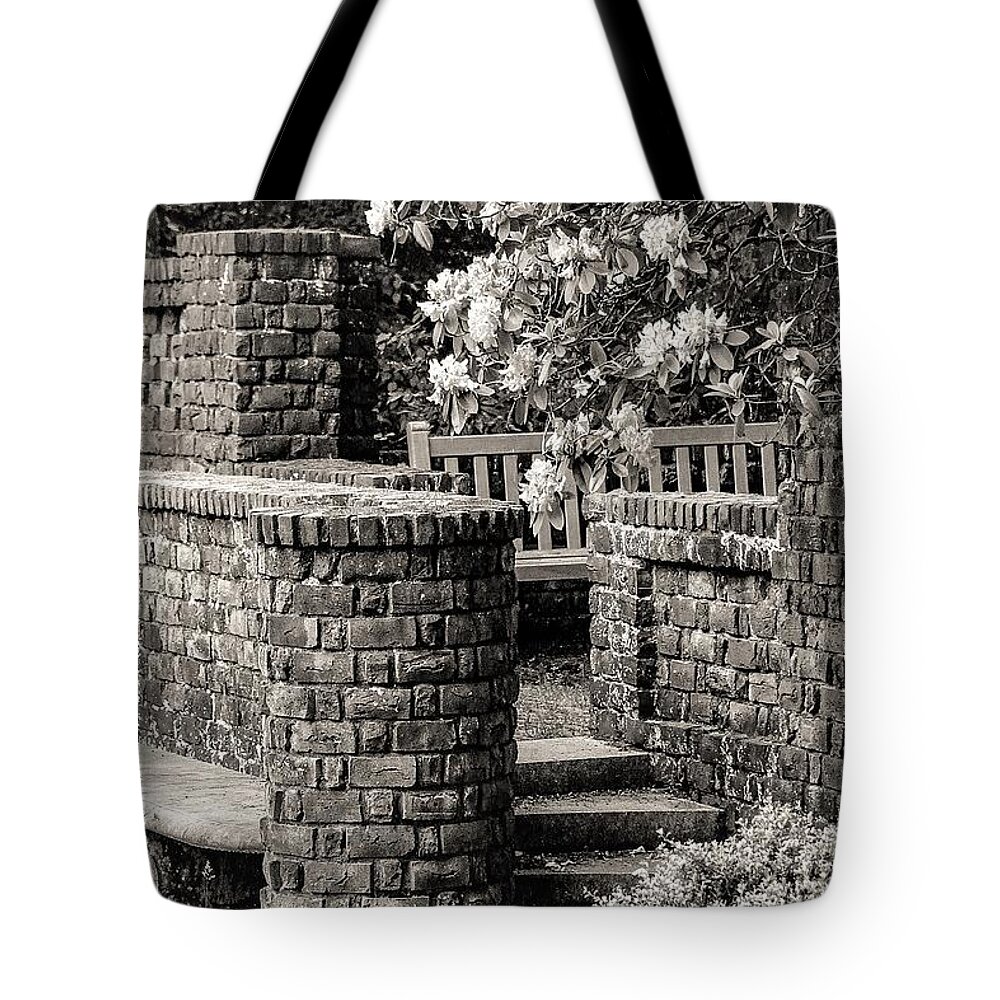 Brick Walls Bench Stairs Flowers B&w Tote Bag featuring the photograph Brick Walls2 by John Linnemeyer