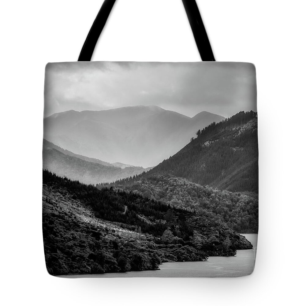 Mountains Tote Bag featuring the photograph Brooding and gloomy by Fran Woods