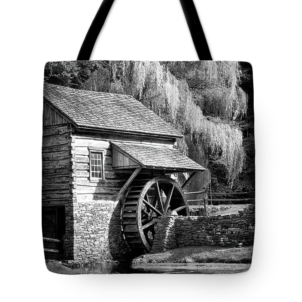 Bucks County Mill In Black And White Tote Bag featuring the photograph Bucks County Mill in black and white by Carolyn Derstine