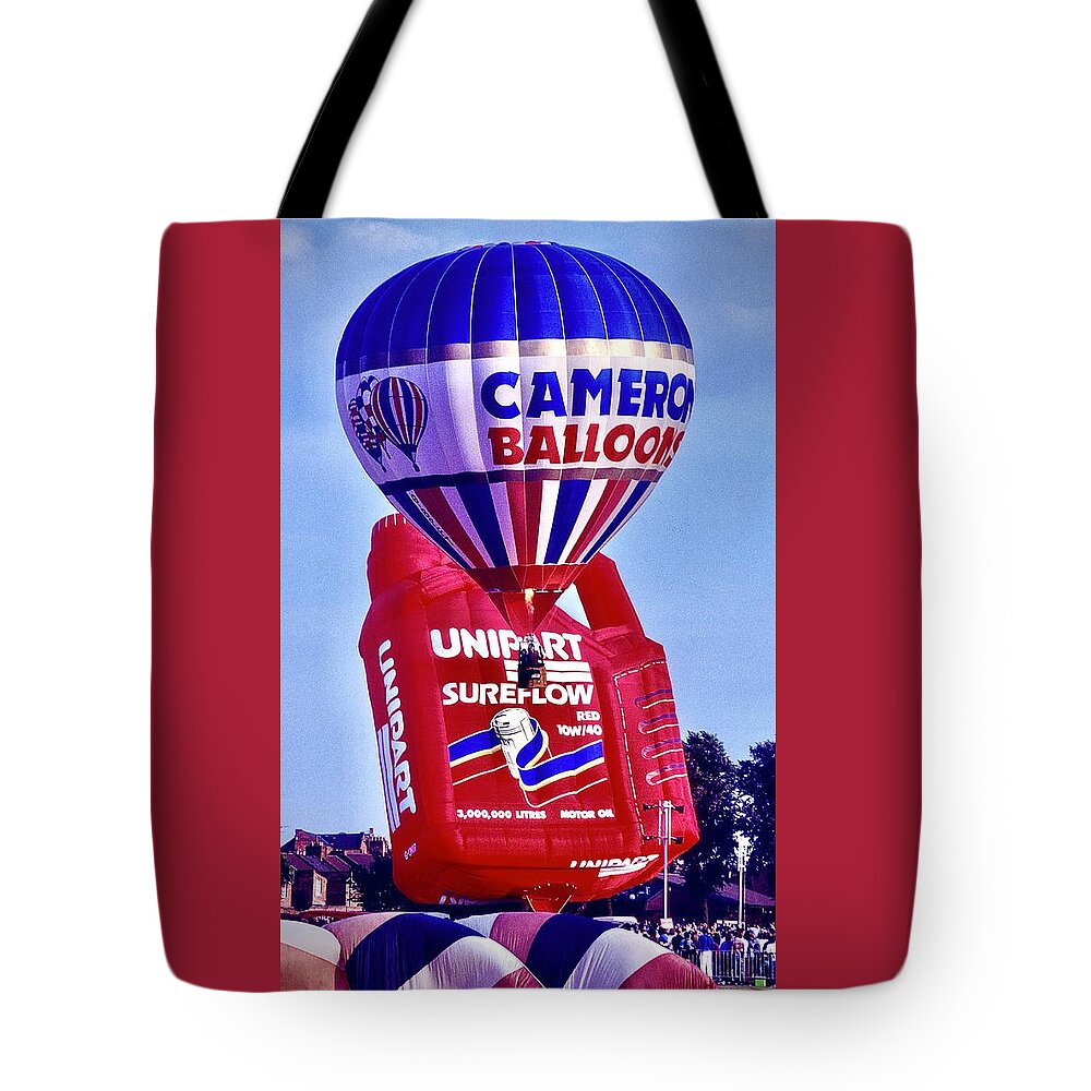  Tote Bag featuring the photograph Cameroon and Unipart Balloons Takeoff by Gordon James