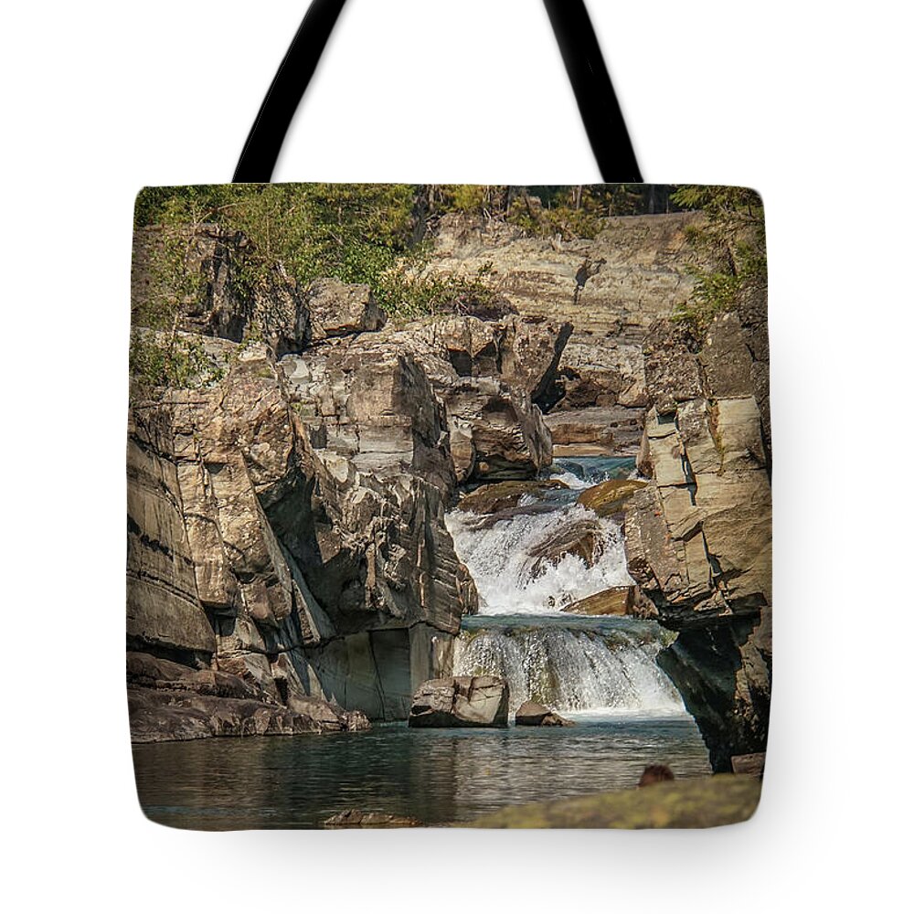 Waterfall Tote Bag featuring the photograph Cascade through Bedrock in Glacier National Park by Nancy Gleason