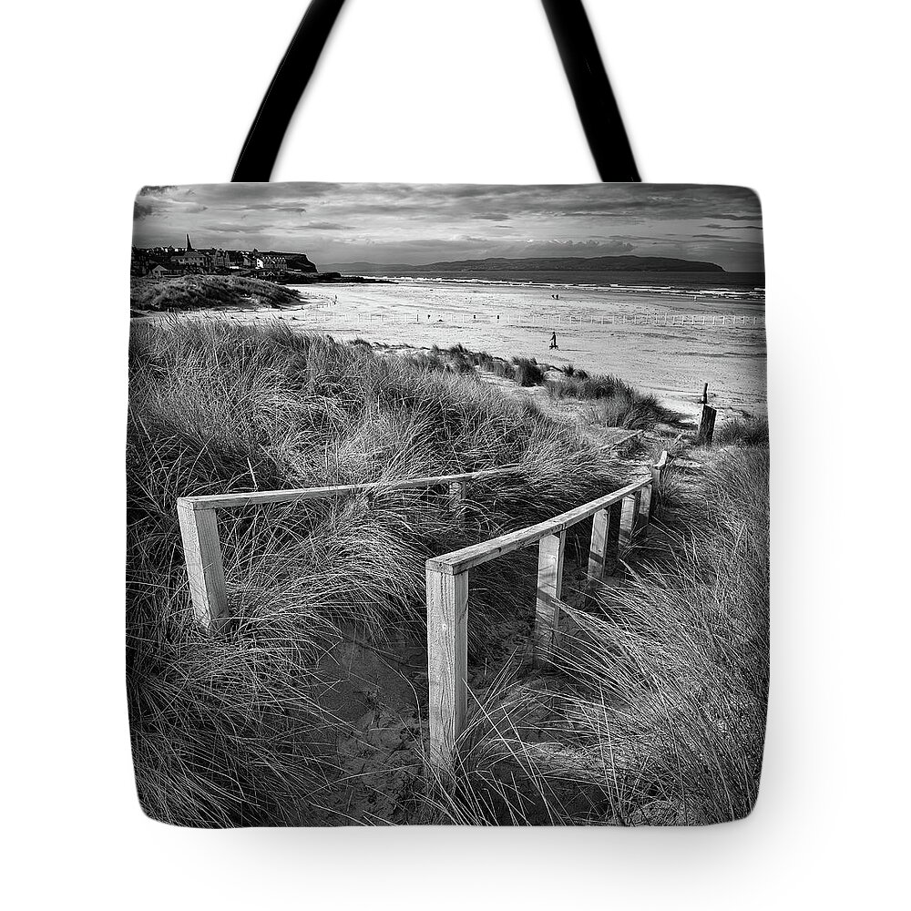 Castlerock Tote Bag featuring the photograph Castlerock Beach by Nigel R Bell