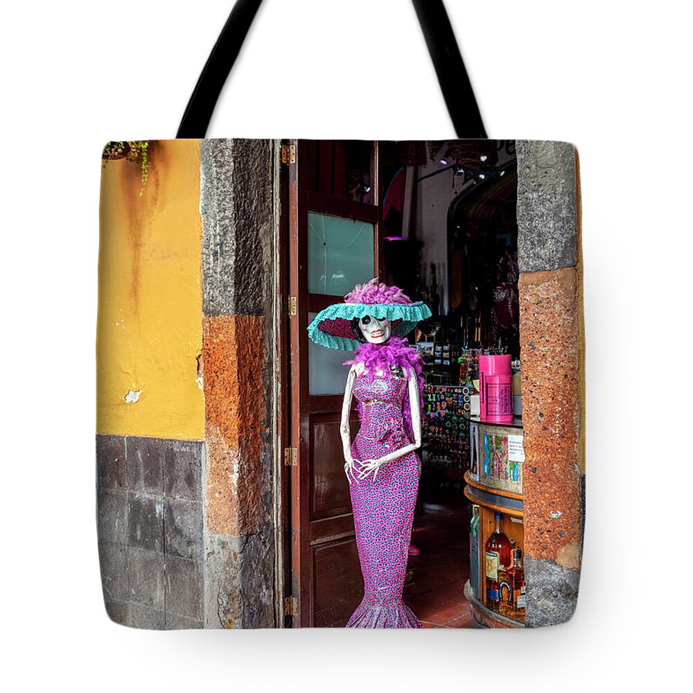 Catrina Tote Bag featuring the photograph Catrina welcomes you by Tatiana Travelways