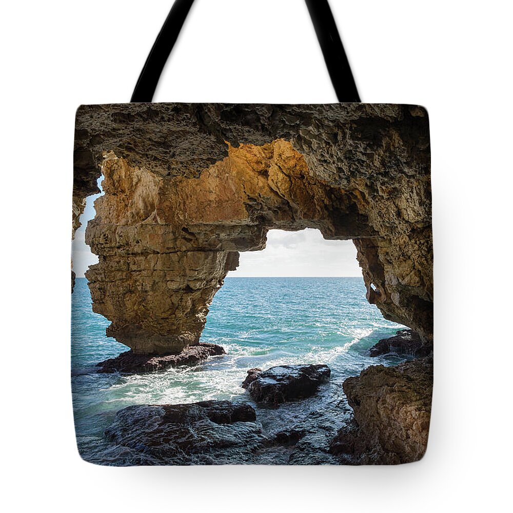 Coast Tote Bag featuring the photograph Cave on the Mediterranean coast, Cova del Arcs by Adriana Mueller