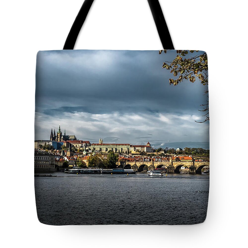 Prague Tote Bag featuring the photograph Charles Bridge Over Moldova River And Hradcany Castle In Prague In The Czech Republic by Andreas Berthold