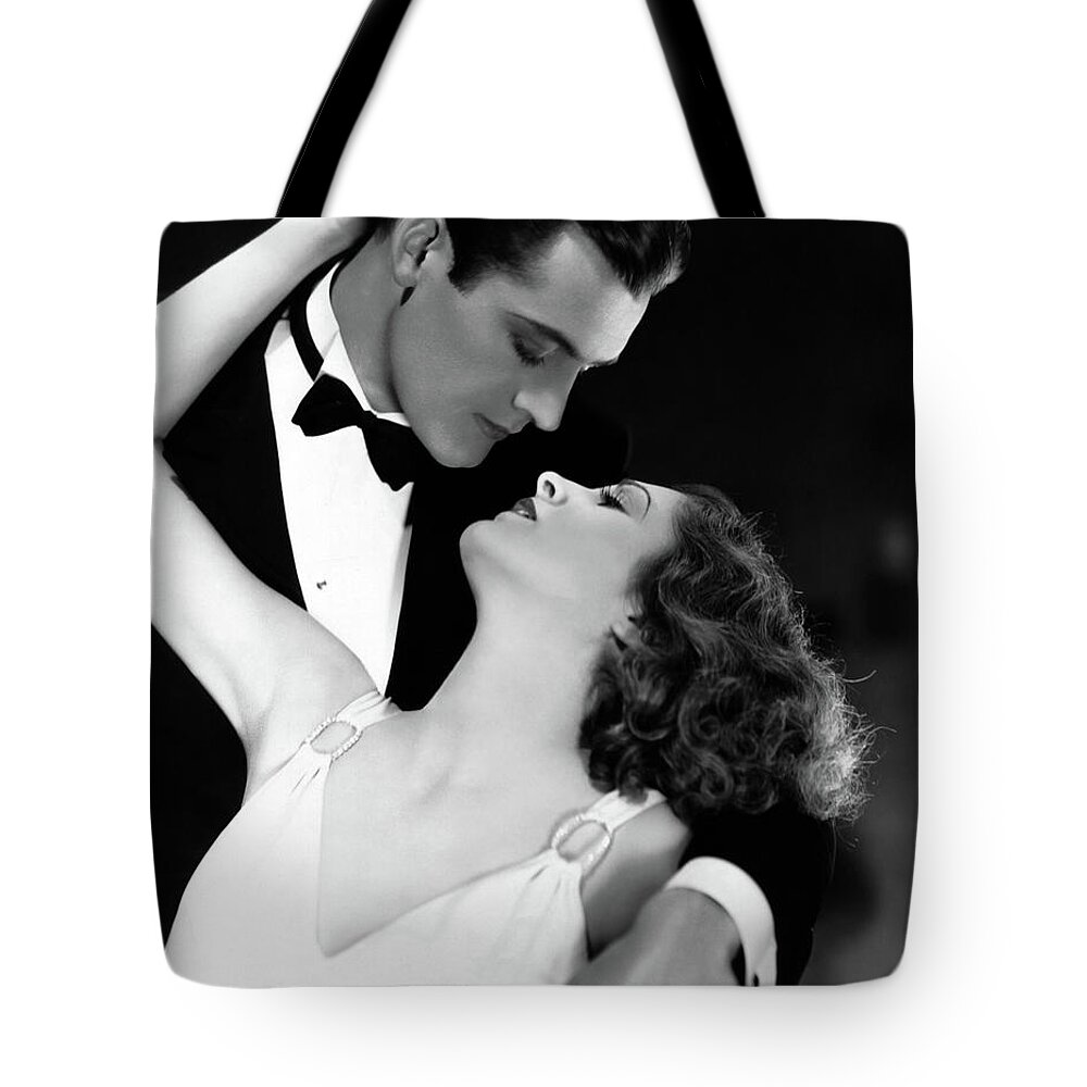 Billie Dove Tote Bag featuring the photograph Charles Starrett Billie Dove The Age For Love 1931 by Sad Hill - Bizarre Los Angeles Archive