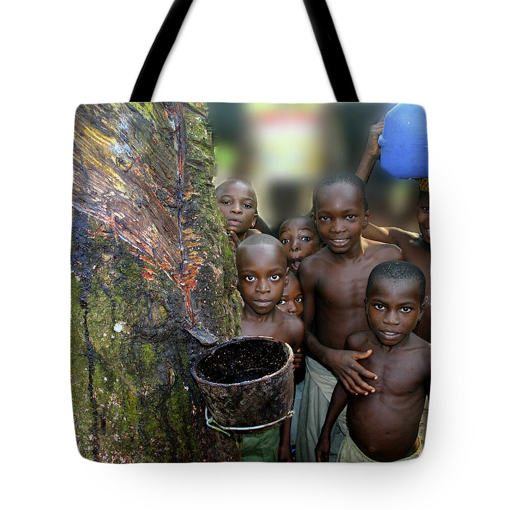 Boys Tote Bag featuring the photograph Children of the Rubber Forest by Wayne King