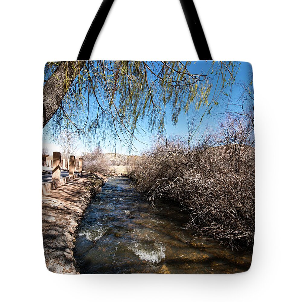 Chimayo Acequia Tote Bag featuring the photograph Chimayo Acequia by Tom Cochran