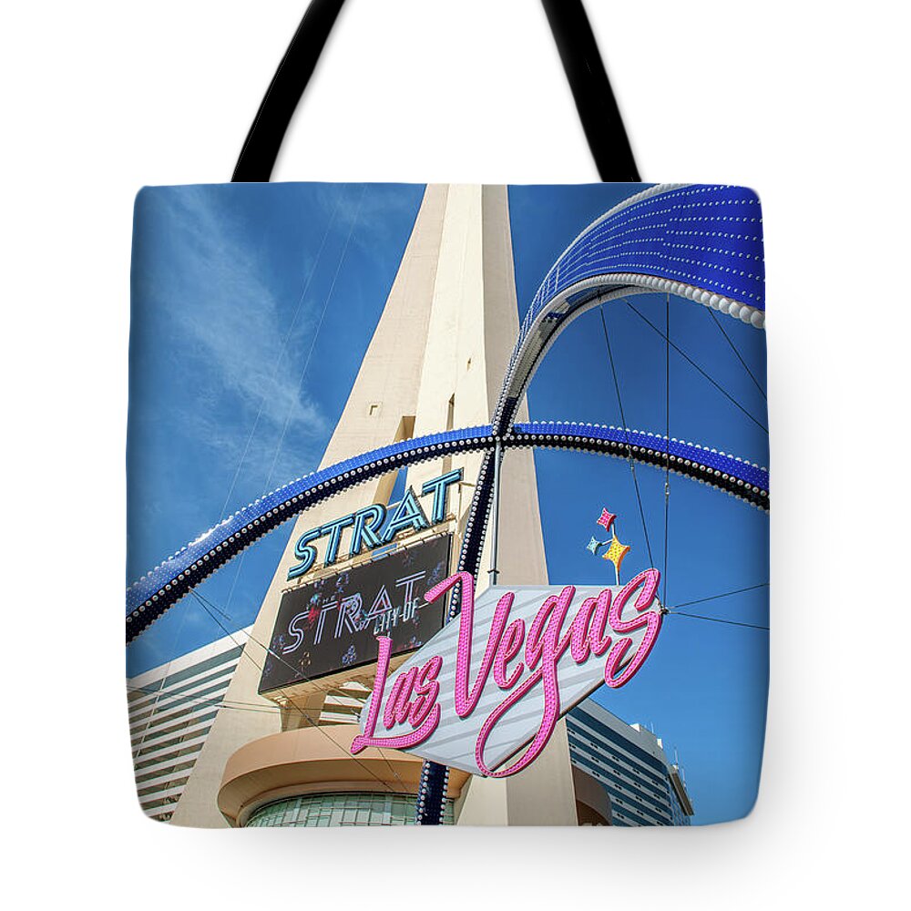 City Of Las Vegas Gateway Arch Tote Bag featuring the photograph City of Las Vegas Arch and the Strat From Below Portrait by Aloha Art