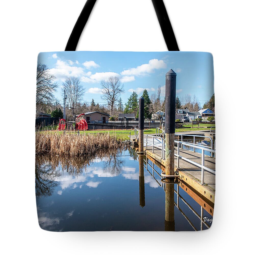 Clear Lake With Reeds Reflecting Tote Bag featuring the photograph Clear Lake with Reeds Reflecting by Tom Cochran