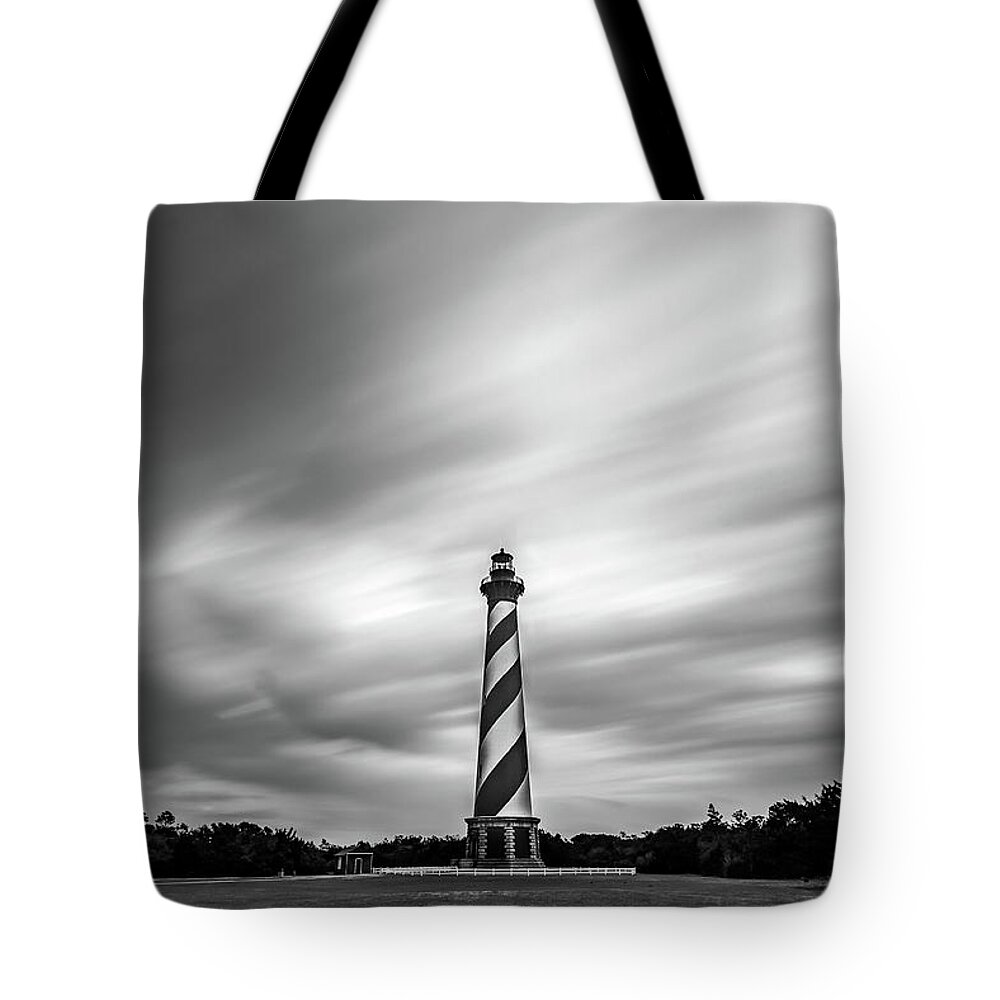 North Carolina Tote Bag featuring the photograph Clouds and lighthouse at Outer Banks, North Carolina by Robert Miller