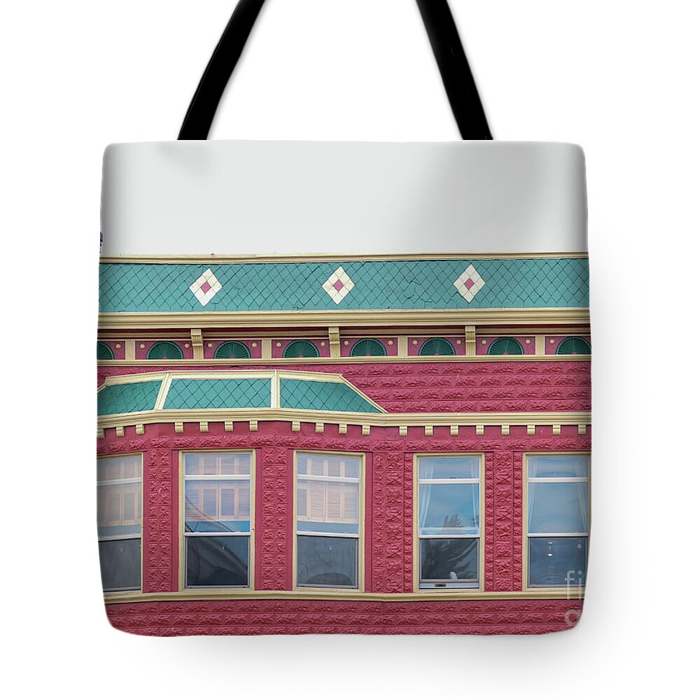 Colorful Tote Bag featuring the photograph Colorful town square building by Bentley Davis