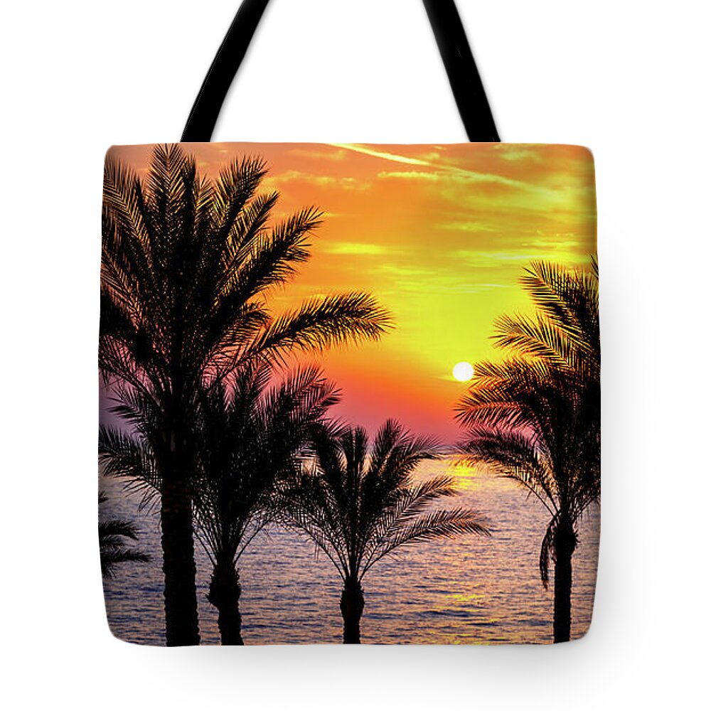 Sunrise Tote Bag featuring the photograph Colourful sunrise over the red sea by Jane Rix