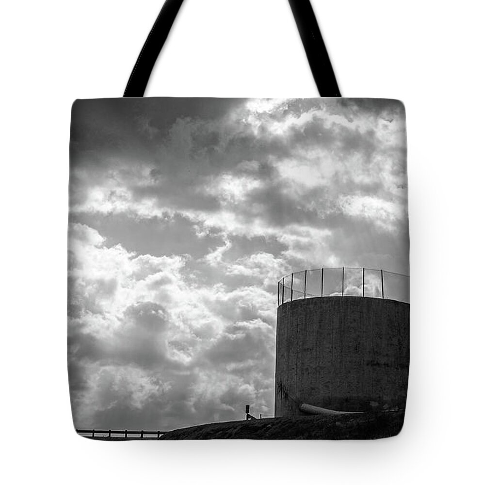 Cement Tote Bag featuring the photograph Concrete dam spillway with stormy skies by Mike Fusaro