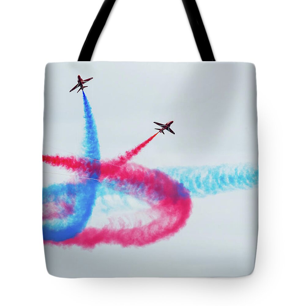 Eastbourne International Airshow Tote Bag featuring the photograph Crossing the Red Arrows by Andrew Lalchan