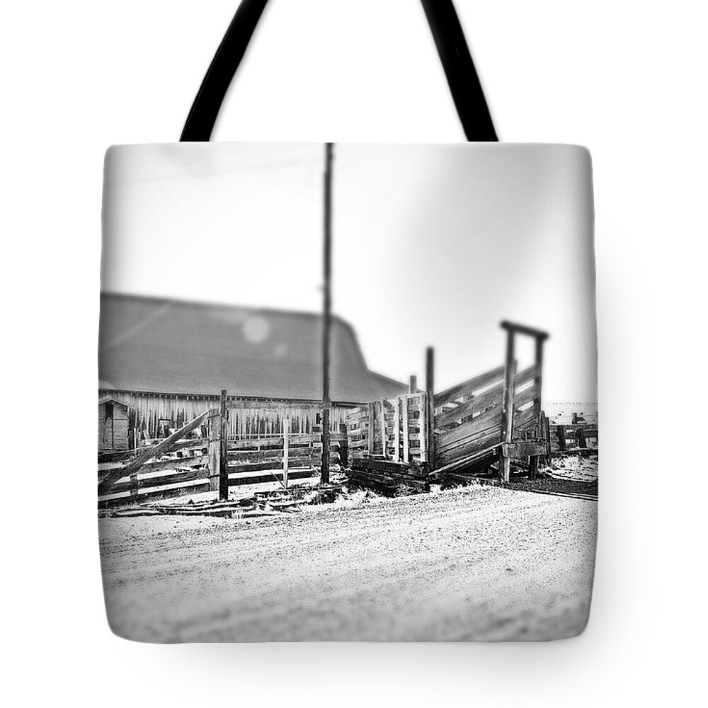  Tote Bag featuring the digital art Dalles, MT Ranch Cattle Shoot. B/W Tilt-shift by Fred Loring