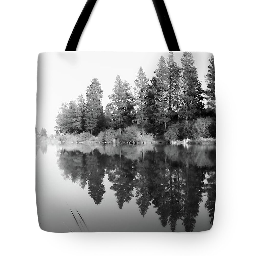 Deschutes River Tote Bag featuring the photograph River Reflections in Black and White by Jason McPheeters