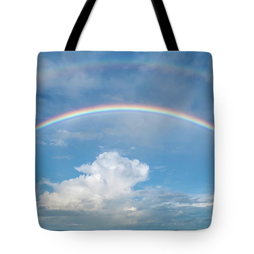 Rainbow Tote Bag featuring the photograph Double rainbow at sea by Bradford Martin
