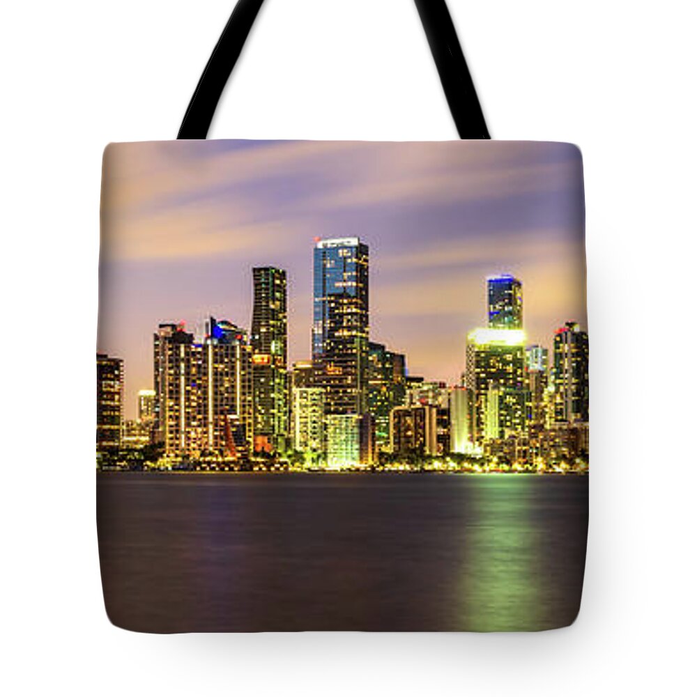 2022 Tote Bag featuring the photograph Downtown Miami Skyline at Night Panorama Photo by Paul Velgos