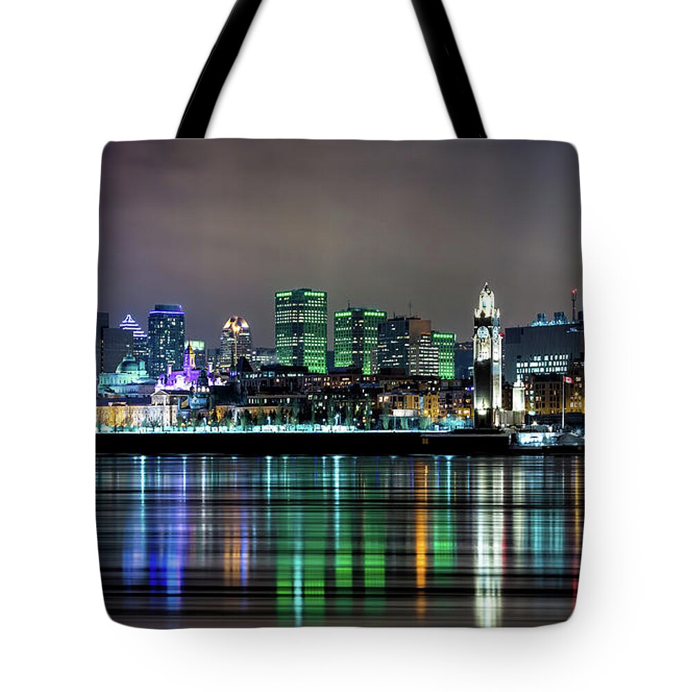 Montreal Tote Bag featuring the photograph Downtown Montreal in winter. Night shot with reflected city ligh by Jane Rix