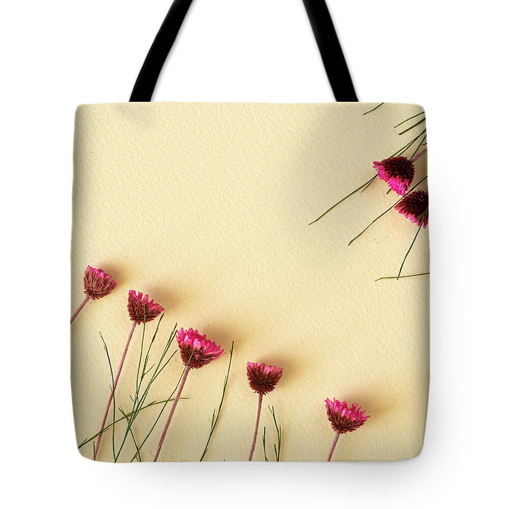 Dry Flowers Tote Bag featuring the photograph Dry purple floral bouquet on yellow background. Flat lay, top vi by Michalakis Ppalis