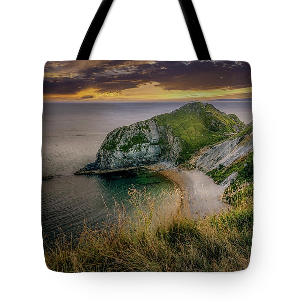 Rock Tote Bag featuring the photograph Durdle Door Headland by Chris Boulton