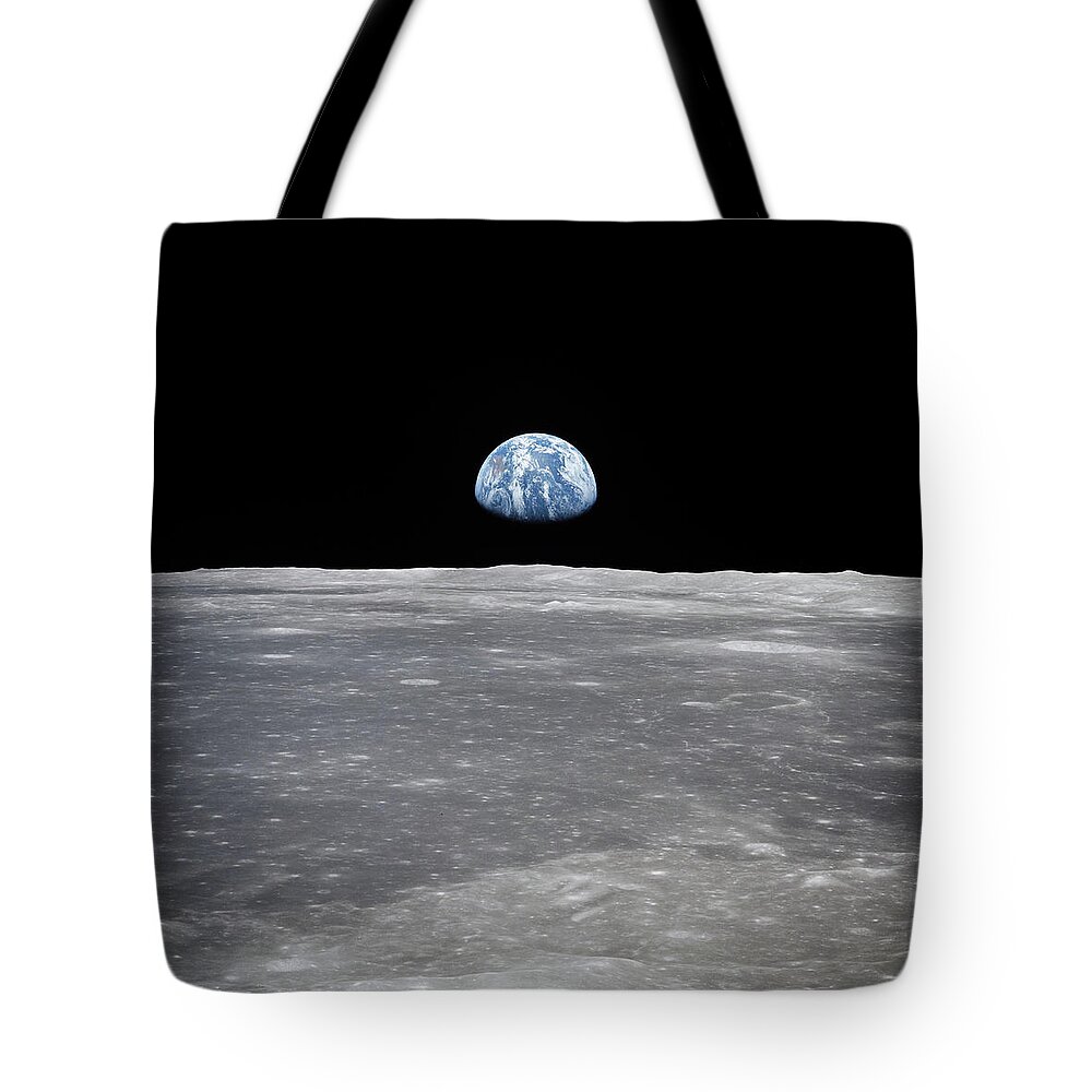Earthrise Over Moon Horizon Tote Bag featuring the digital art Earthrise over moon surface by Stoneworks Imagery