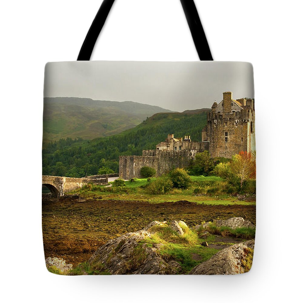 Scotland Tote Bag featuring the photograph Eilean Donan Castle in the loch Alsh at the highlands of Scotlan by Michalakis Ppalis