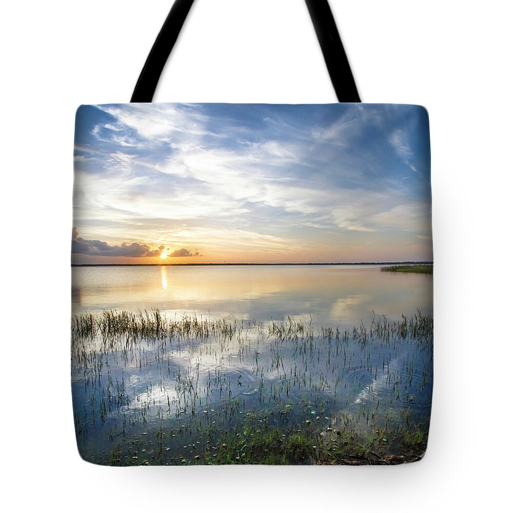 Boats Tote Bag featuring the photograph Evening Clouds over the Lake by Debra and Dave Vanderlaan