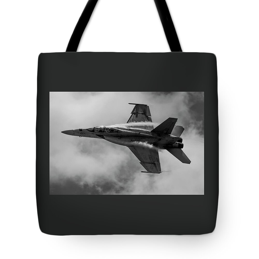 Airplane Tote Bag featuring the photograph F18 in Black and White by Carolyn Hutchins