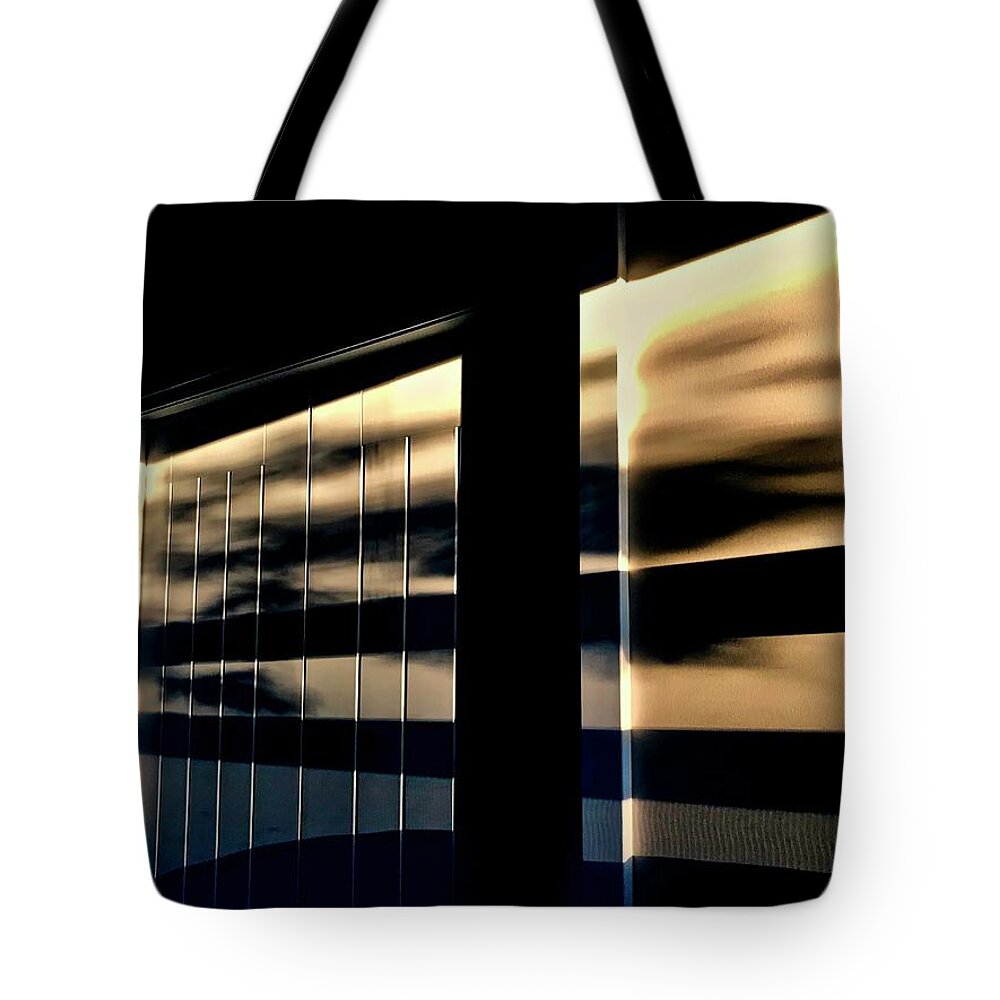 Faces In The Shadows As The Sun Sets. Tote Bag featuring the photograph Faces in the Shadows as the sun sets by Brian Sereda