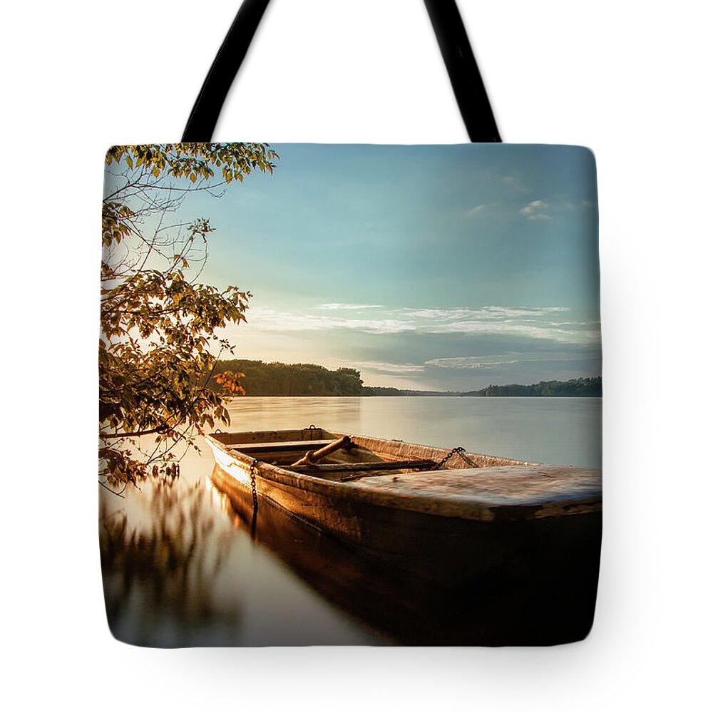 Rowboat Tote Bag featuring the photograph Fairy-tale boat moored on the shore by Vaclav Sonnek