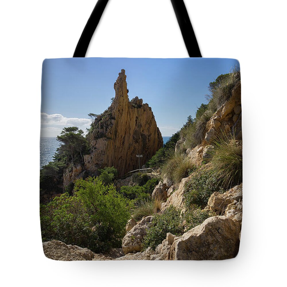 Mediterranean Tote Bag featuring the photograph Falla del Moraig, Rocks and the Mediterranean Sea by Adriana Mueller