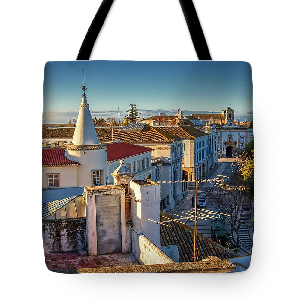 Faro Portugal Tote Bag featuring the photograph Faro Portugal rooftops in the morning light by Tatiana Travelways
