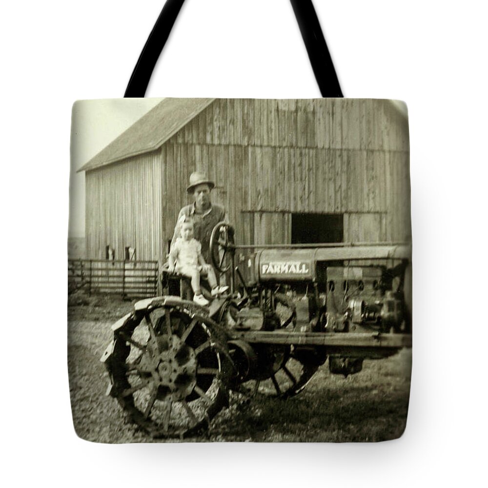 Joyce Phillippi Tote Bag featuring the photograph Father Daughter Farmall by Unknown
