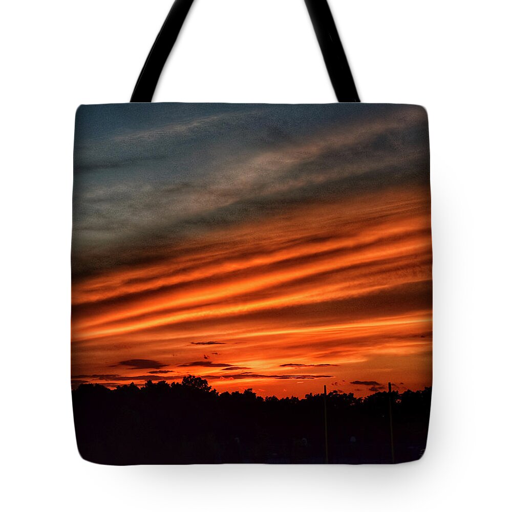 Sunset Tote Bag featuring the photograph Fiery end of the day by Monika Salvan