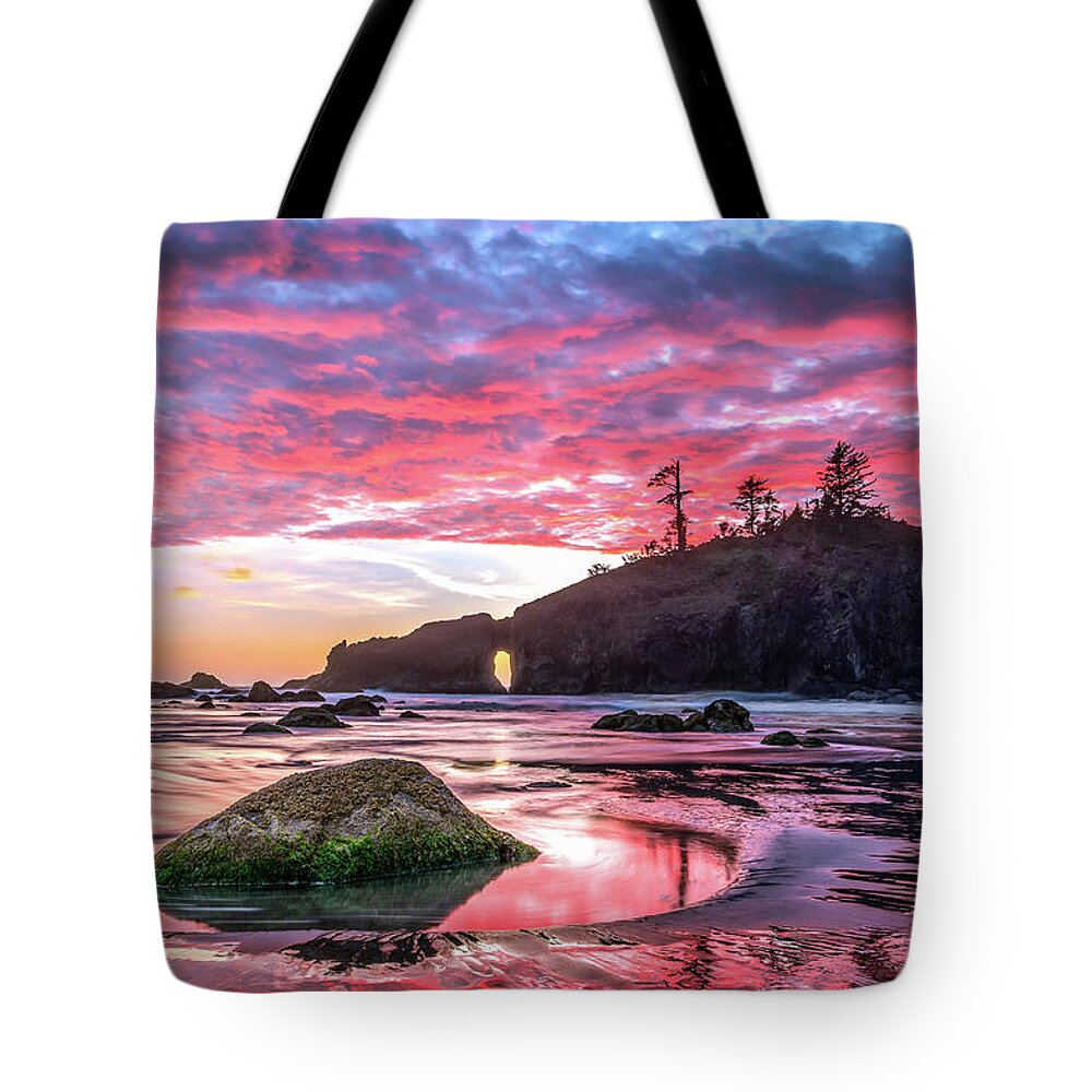 Sunset Tote Bag featuring the photograph Fiery sky reflected in the water in OIympic National Park by Robert Miller