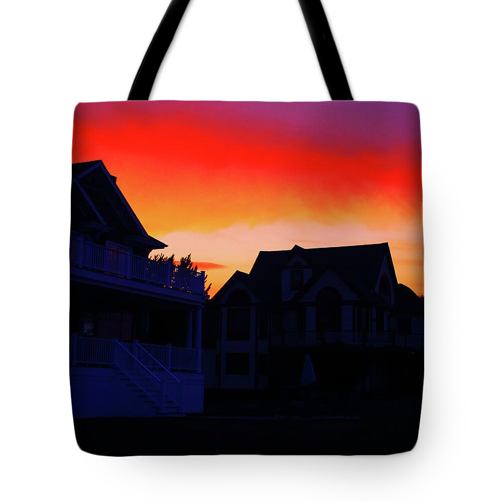 Scenic Tote Bag featuring the photograph Fire in the Sky by Jim Feldman