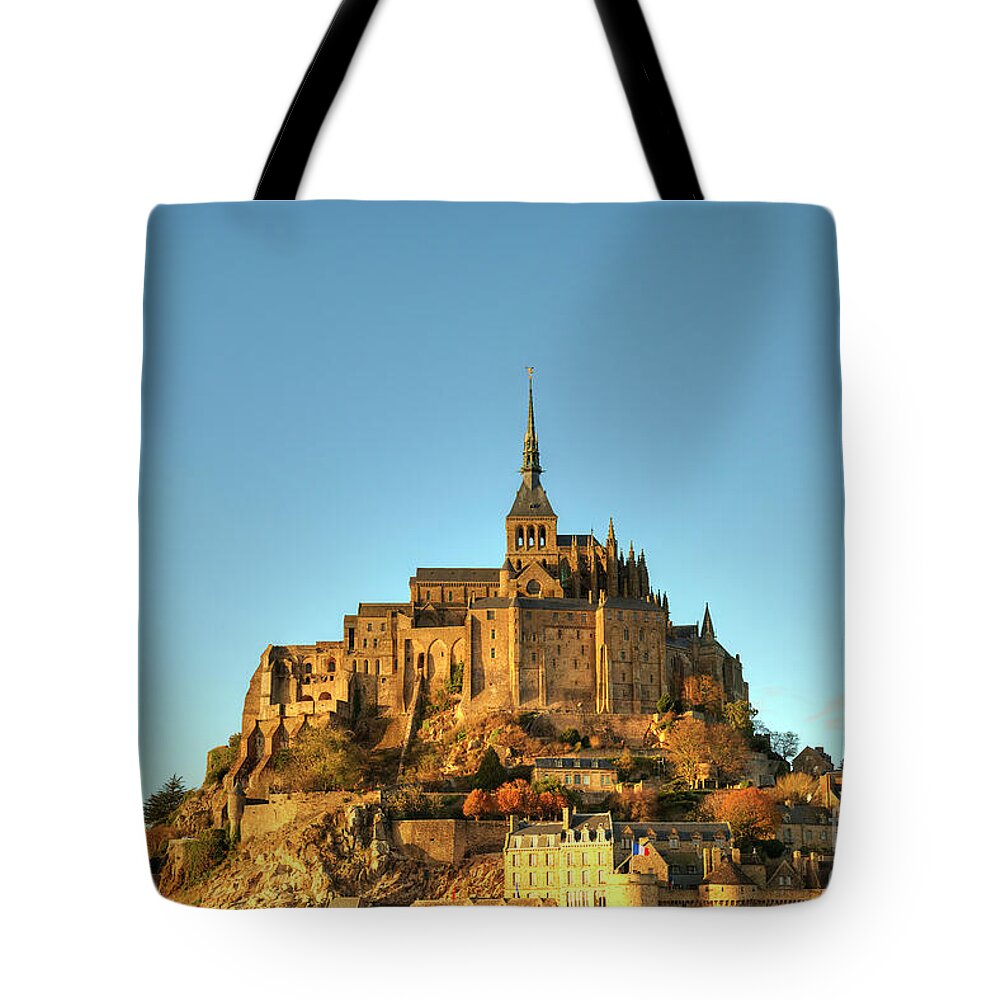  Mont Saint Michel Tote Bag featuring the photograph First Impressions Mont Saint Michel Normandy France by Wayne Moran