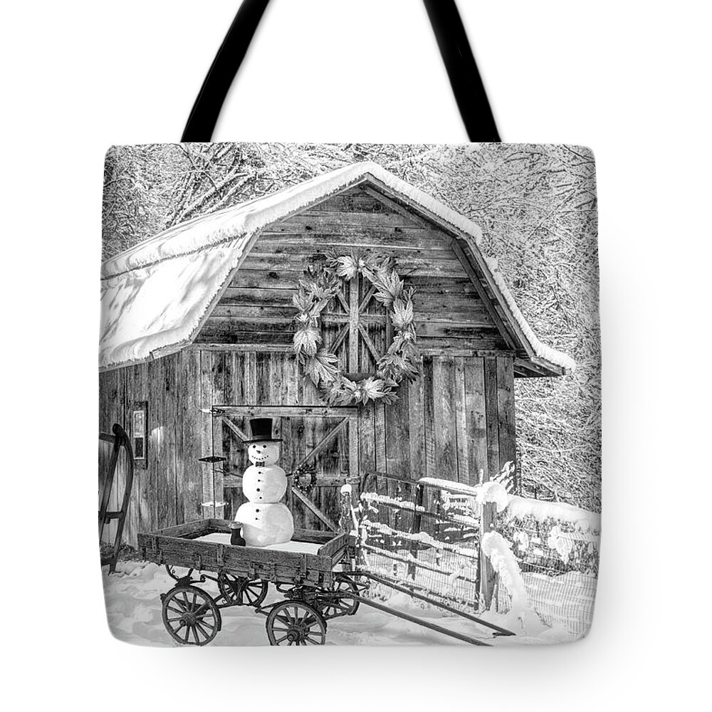 White Tote Bag featuring the photograph First Snowman of the Season Black and White by Debra and Dave Vanderlaan