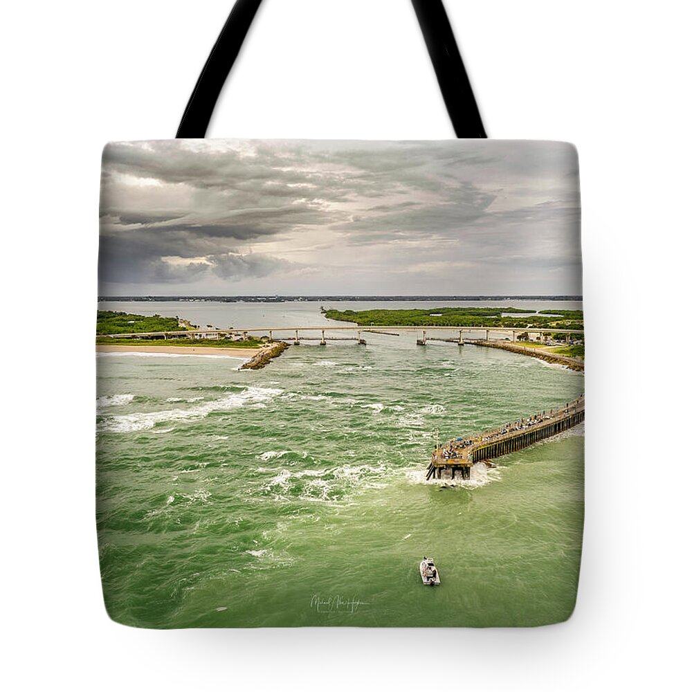 Sebastian Inlet Tote Bag featuring the photograph Fishing through the Storm by Veterans Aerial Media LLC
