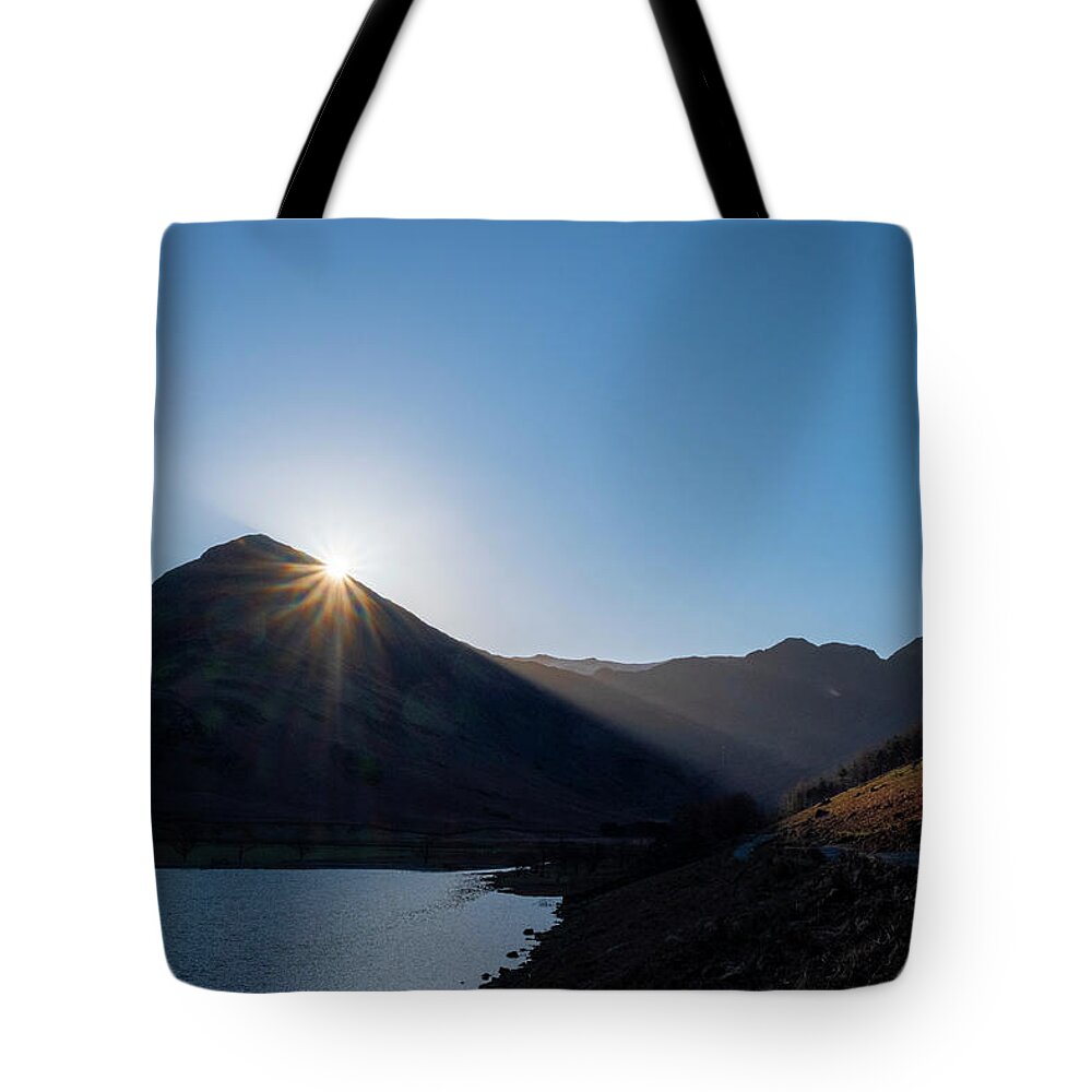 Buttermere Cumbria Tote Bag featuring the mixed media Fleetwith Pike Sunburst, Buttermere by Smart Aviation